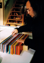 Jun Kaneko arranging colored glass panels 