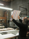 Jun Kaneko inspecting glass panels